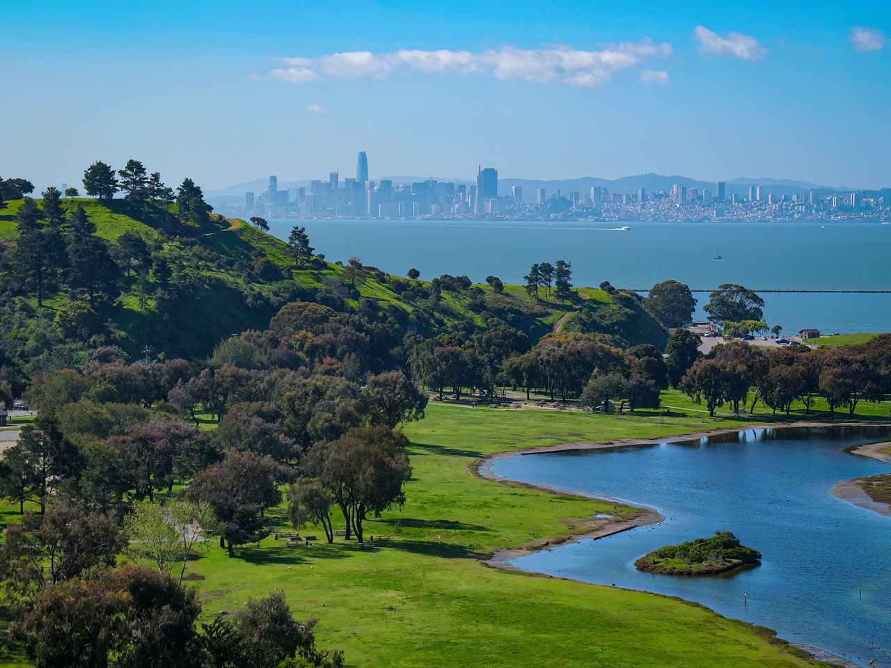 Crafting Captivating Headlines: Your awesome post title goes here A vibrant aerial view of a green park leading to a city skyline across the bay.