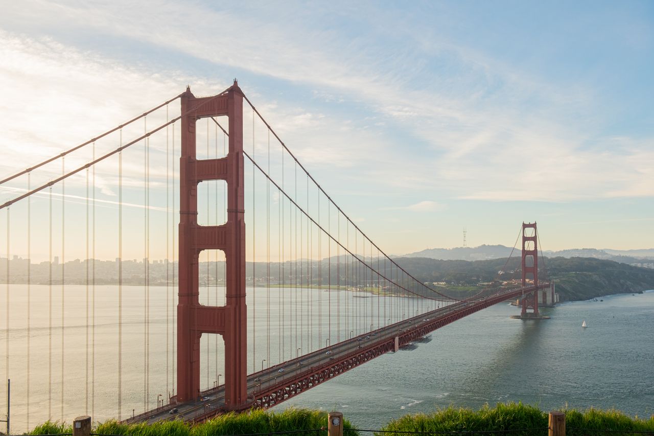 journey-01 Iconic view of Golden Gate Bridge at sunset in San Francisco, California.