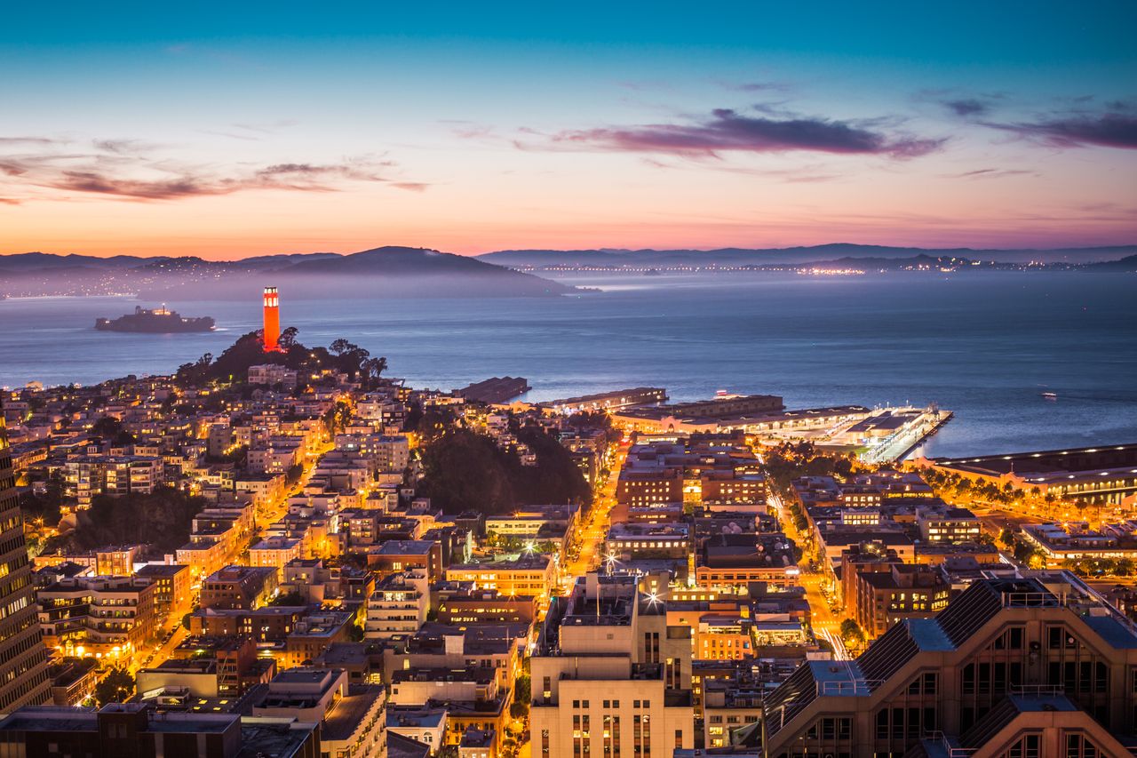 The Art of Drawing Readers In: Your attractive post title goes here A breathtaking view of San Francisco's skyline and bay at dusk with city lights aglow.