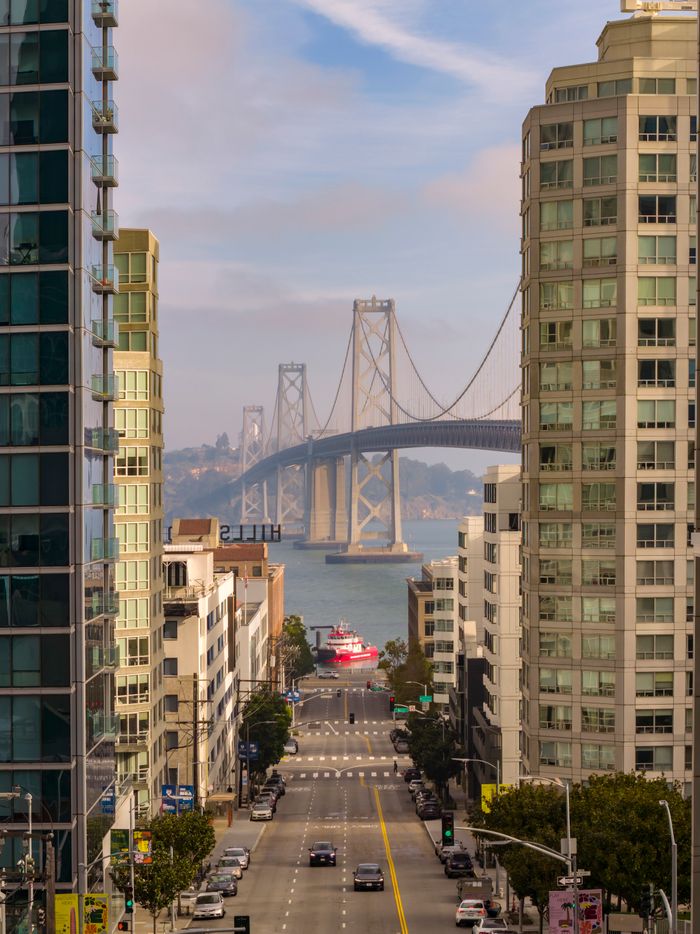 gallery-03 Scenic view of the Bay Bridge framed by downtown San Francisco buildings.