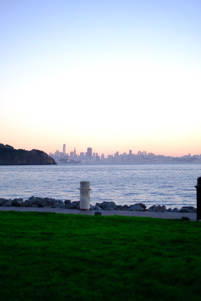 A serene view of San Francisco skyline across the bay from Tiburon at dusk.