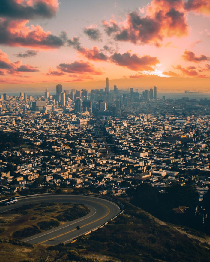 services-01 Stunning aerial view of San Francisco skyline with vibrant sunset sky.